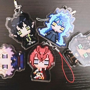 May include: A collection of pixelated character keychains. The keychains feature various anime-style characters with distinct hair colors and outfits. Each keychain has a silver-colored chain and a clear plastic backing.