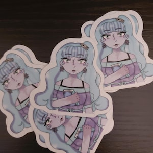 May include: A set of three ceramic mugs with a speckled, matte finish. Each mug features a different color: light blue, cream, and gray. The mugs have a simple, modern design, perfect for coffee or tea.