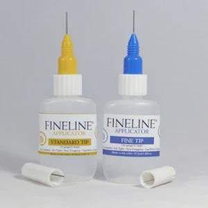 May include: Two Fineline Applicator bottles with white bodies, one with a yellow tip and the other with a blue tip. Each bottle has a white label with black text. Two white applicator tips are in front of the bottles.