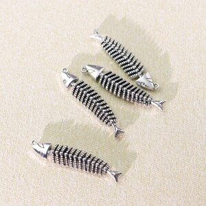 Personalized accessories: fishbone keychains, metal bag charms