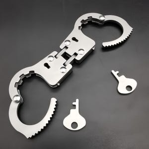 Mini handbojeleksak, förtjockad nyckelring, tummanschett för skojs skull
