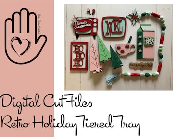 May include: Digital cut files for a retro holiday tiered tray. The design features a red and green color scheme with various Christmas-themed elements, including a TV, a tree, a cup, and a milk carton. The text "Merry Christmas", "Noel", "Ho Ho Ho", and "Egg Nog" is included in the design.