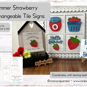 May include: Interchangeable tile signs with a summer strawberry theme. The signs feature a variety of designs, including a jar of strawberry jam, a basket of strawberries, a strawberry with the text "Hello Summer", and a sign that says "Berry Sweet".