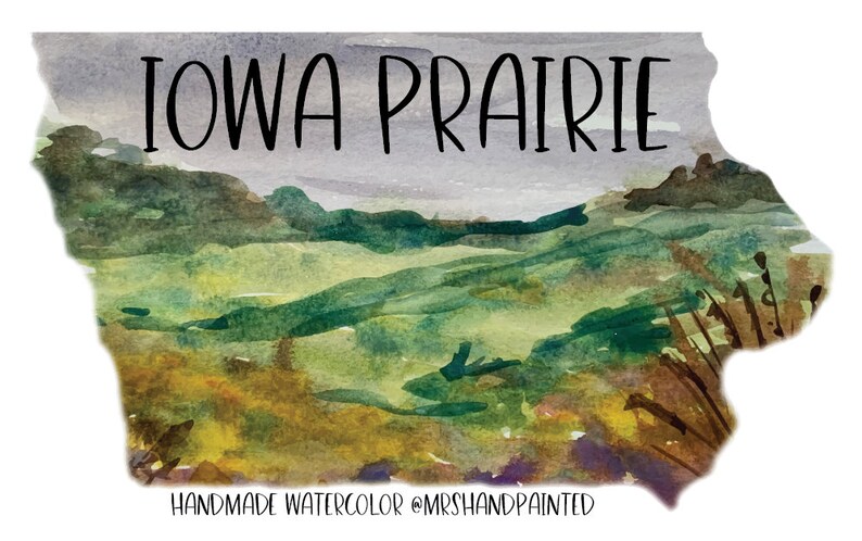 May include: Watercolor painting of a landscape in shades of green, brown, and yellow, depicting a rolling prairie with the text "IOWA PRAIRIE" at the top and "HANDMADE WATERCOLOR @MRSHANDPAINTED" at the bottom.