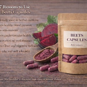 May include: A kraft paper bag labeled "BEETS CAPSULES" with a clear window revealing pink capsules. The image includes sliced beets, beet powder in a wooden spoon, and text listing the benefits of the capsules. The background is a wooden surface.