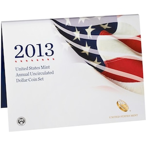 May include: A white folder for the 2013 United States Mint Annual Uncirculated Dollar Coin Set. The cover features the text 2013, a graphic of the American flag, the United States Mint logo, and a small circular seal in the bottom left corner.