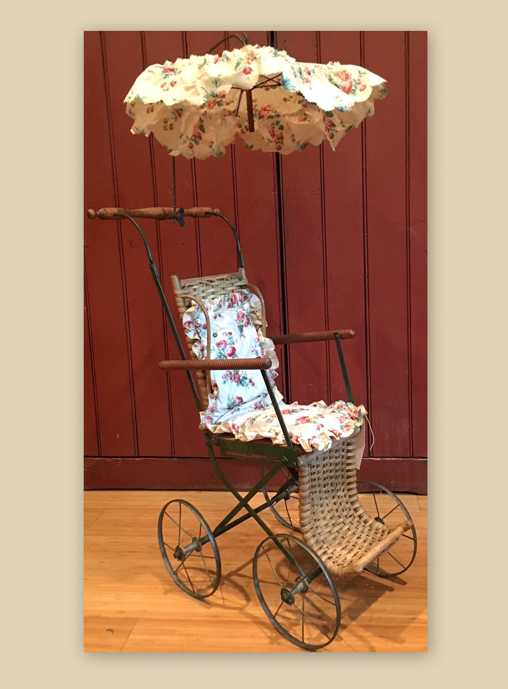 antique wicker baby carriage with parasol