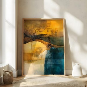 May include: Abstract landscape art print in a wooden frame. The artwork features a blend of colors, including shades of yellow, blue, and brown. The composition has a textured appearance, with a mix of geometric and organic shapes. The artwork is displayed in a well-lit room.