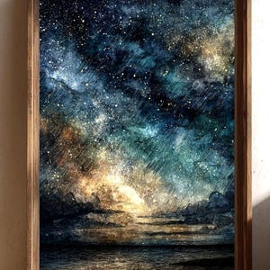 May include: A framed art print depicting a celestial scene. The artwork features a dark blue and teal night sky filled with stars and illuminated by a golden glow. The bottom of the image shows a dark body of water.