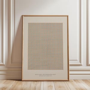 以下が含まれることがあります： ベージュの背景に、オレンジとティールの小さな正方形の幾何学模様が描かれた額入りのアートプリント。下部には「GALLERY OF MODERN ART ABSTRACT ART EXHIBITION」の文字が印刷されています。フレームはライトブラウンです。