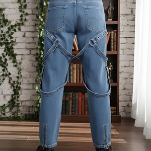 Gothic Harness Strap Denim Jeans, Back view of denim pants with adjustable straps and buckle design, gothic techwear style jeans with slim fit