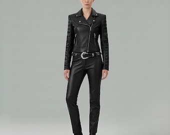 May include: A black leather jacket with quilted shoulder details, a silver zipper, and a matching belt. The jacket is paired with black leather pants and black heeled boots. The outfit is a classic, edgy style.