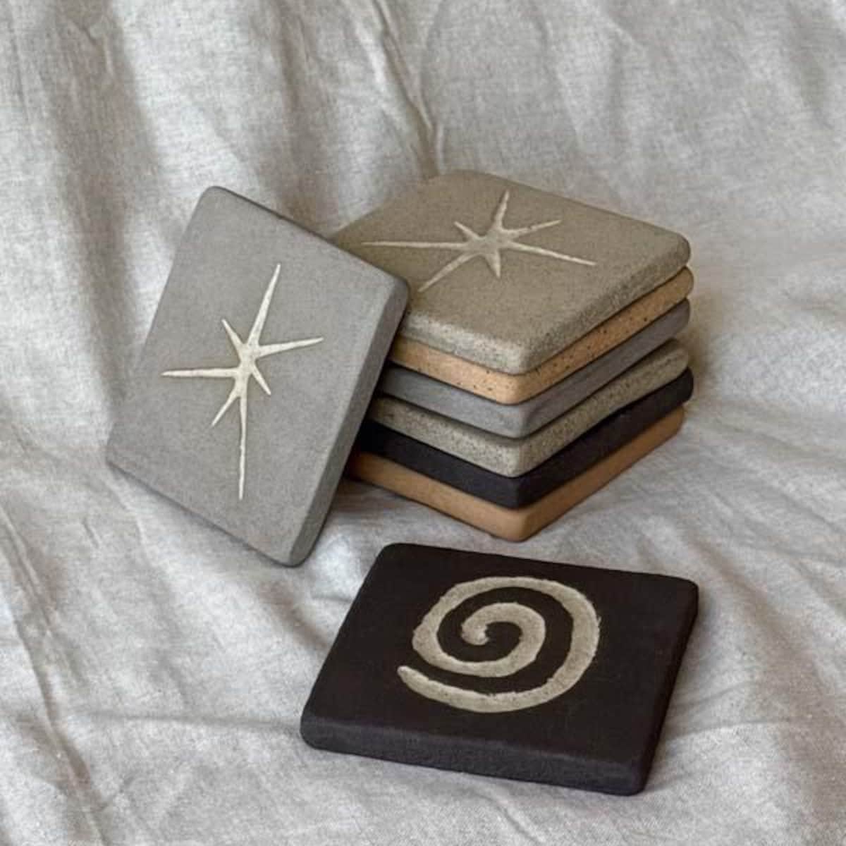 handmade ceramic coasters with carvings