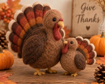 May include: Two needle-felted turkey figurines made of brown wool. The larger turkey has a fanned tail with layers of brown, orange, and cream, a red wattle, and a yellow beak. The smaller turkey features a similar design.