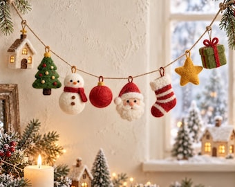 May include: A felt Christmas garland featuring a series of hanging ornaments including a small house, a green tree, a white snowman, a red sphere, a Santa Claus face, a red and white striped stocking, a yellow star, and a green gift box.