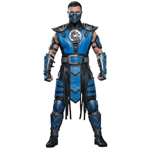 May include: A character in a blue and black costume is shown from head to toe. The costume includes a mask, shoulder pads, and armour on the arms and legs. A silver emblem is on the chest. The character stands with their arms at their sides.