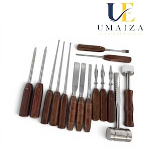 May include: A set of fifteen metal hand tools with dark brown wooden handles, including various awls, spatulas, chisels, and a mallet with a white head. The tools are arranged in a group, featuring metallic shafts and polished wooden grips.