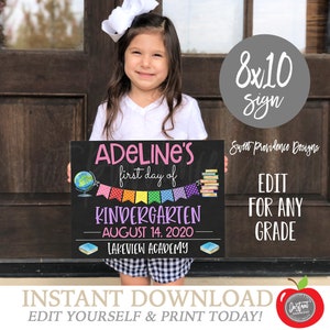 May include: A printable 8x10 inch sign for a child's first day of kindergarten. The sign is black with white chalk-style text and colorful illustrations. The text reads "ADELINE'S first day of KINDERGARTEN - AUGUST 14, 2020 - LAKEVIEW ACADEMY".