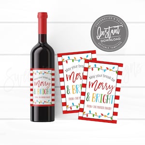 May include: A bottle of red wine with a label that reads "Merry & Bright" with a festive design. Two matching gift tags are next to the bottle. The tags and label have a red and white striped border and colorful string lights.