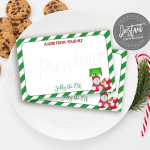 Pu&ograve; includere: Due biglietti da visita stampabili con strisce verdi e bianche. I biglietti presentano una calza rossa e bianca con un polsino verde e il testo "A Note From Your Elf" e "Jolly the Elf".