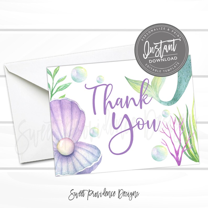 May include: Purple and green mermaid tail thank you card with a pearl and seashells. The card has the text "Thank You" in purple lettering.