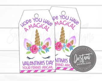 May include: Two white Valentine's Day gift tags with a unicorn design. The tags feature a gold horn, pink roses, and the text "Hope You Have A Magical Valentine's Day". The tags are personalized with the name "Abigail".