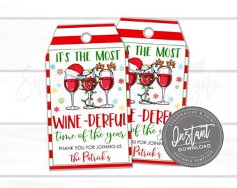 May include: Two Christmas-themed gift tags with a red and white striped border. The tags feature wine glasses decorated with Santa hats and reindeer antlers, strung with Christmas lights. Text includes "It's the Most Wine-derful Time of the Year."