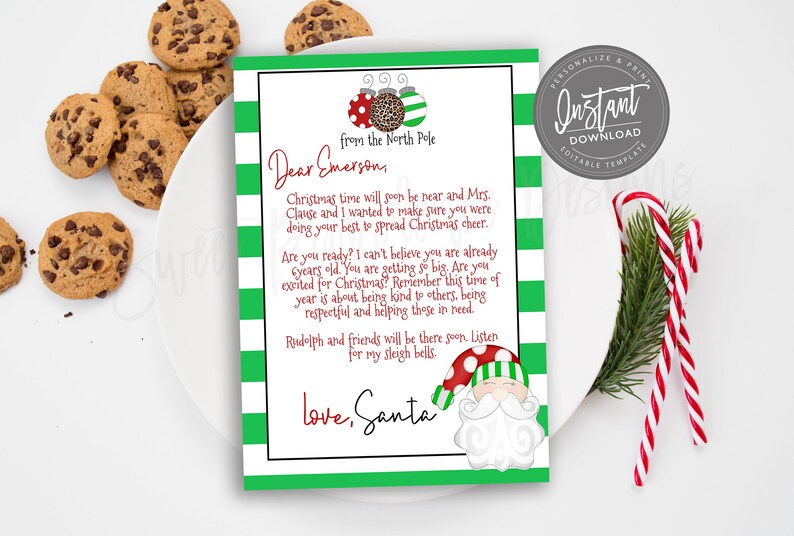 May include: A personalised Christmas letter from Santa, with a green and white striped border and festive illustrations. The letter includes the text "Dear Emerson" and "love, Santa", with chocolate chip cookies and candy canes.