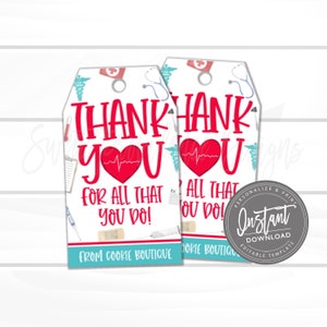 May include: Two printable gift tags with a white background and a blue and red medical theme. The tags say "Thank You for all that you do!" and feature a red heart with a heartbeat line. The tags are from Cookie Boutique.