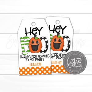 May include: Two Halloween-themed gift tags with a white background. The tags feature a pumpkin design with the word "BOO" and the text "Thanks for coming to my party". The tags also include the text "Hey" and "Emma Ray".