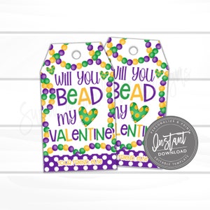 May include: Two printable Valentine's Day gift tags featuring a Mardi Gras theme. The tags are white with purple and green polka dots. The text on the tags reads "Will you Bead my Valentine?" with a heart and beads in the background. The tags are editable and can be personalised with a name.