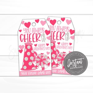 May include: Two pink and white printable Valentine's Day gift tags with a cheerleader theme. The tags feature a megaphone and a pom-pom with the text "You Always Cheer Me Up Happy Valentine's Day".