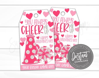 Può includere: Due etichette regalo stampabili per San Valentino rosa e bianche a tema cheerleader. Le etichette mostrano un megafono e un pompon con il testo "You Always Cheer Me Up Happy Valentine's Day".