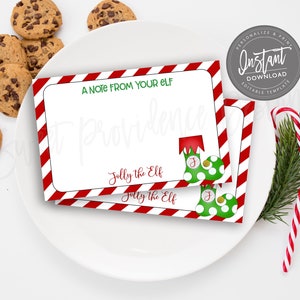 May include: White cards with red and white striped borders, text "A NOTE FROM YOUR ELF" and "Jolly the Elf". The cards are decorated with green elf shoes and are on a white plate with chocolate chip cookies and candy canes.