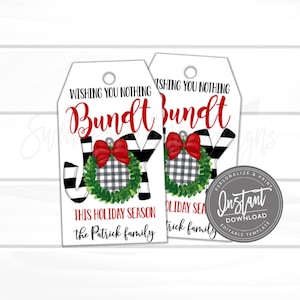 May include: Two white gift tags with a Christmas theme. The tags feature the words "Wishing You Nothing Bundt Joy" in red and black. A wreath with a red bow and the words "This Holiday Season" are also visible. A circular "Instant Download" graphic is on the right.