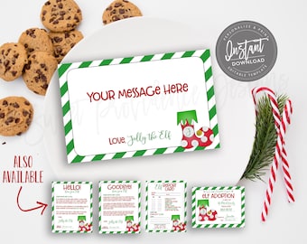 May include: A white card with green striped borders and the text "YOUR MESSAGE HERE" in red, with a red and white polka-dot elf boot illustration. The card is on a white plate with chocolate chip cookies and candy canes.