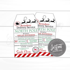 May include: Two Christmas-themed gift tags with a red and white striped border. The tags read "Reindeer Delivery Service, North Pole" and include space for a recipient's name and delivery notes. The tags feature a Santa Claus seal and reindeer imagery.