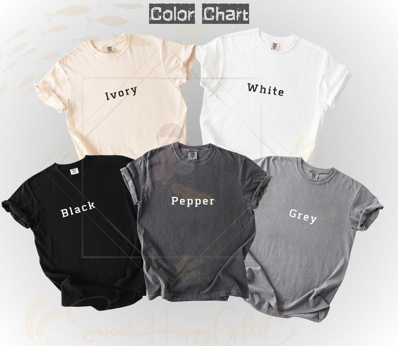 May include: A color chart of five t-shirts in ivory, white, black, pepper, and grey. The shirts are short-sleeved and have a crew neck. The text "Color Chart" is at the top of the image, with the color names printed on each shirt.