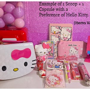 May include: A collection of Hello Kitty themed stationery and accessories including a white quilted handbag, a pink pencil case, a spiral notebook, pens, a small figurine, a pink plastic stand, and various small items labeled Example of 1 Scoop + 1 Capsule with a Preference of Hello Kitty. (Items Vary).