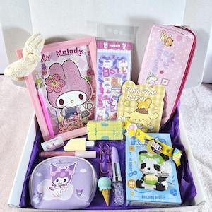 May include: A gift box filled with various Sanrio-themed items. Includes a My Melody notebook, pencil case, and stickers. Also features a Kuromi cosmetic bag, a Pom Pom Purin notepad, a building block set, and other accessories.