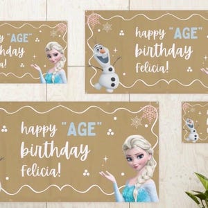 Puede incluir: Un conjunto de pancartas de cumplea&ntilde;os con Elsa y Olaf de Frozen. Las pancartas son de color marr&oacute;n claro con texto blanco que dice "happy 'AGE' birthday Felicia!" y copos de nieve y remolinos decorativos. Las pancartas vienen en varios tama&ntilde;os.