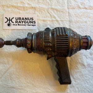 May include: A rustic wooden sign with the text "Welcome to our home" in a handwritten style. The sign features a distressed finish and a simple, inviting design, perfect for a front porch or entryway.