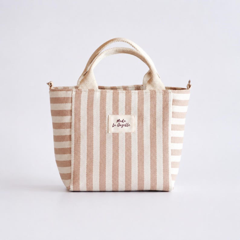 Small handmade tote bag sewing project with zipper pocket inside