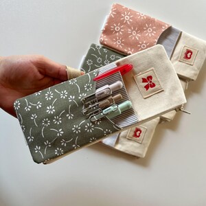 Journal pencil holder attached to hardcover notebook