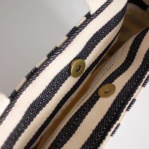 Fabric mini tote bag with short handles and long strap for crossbody wear