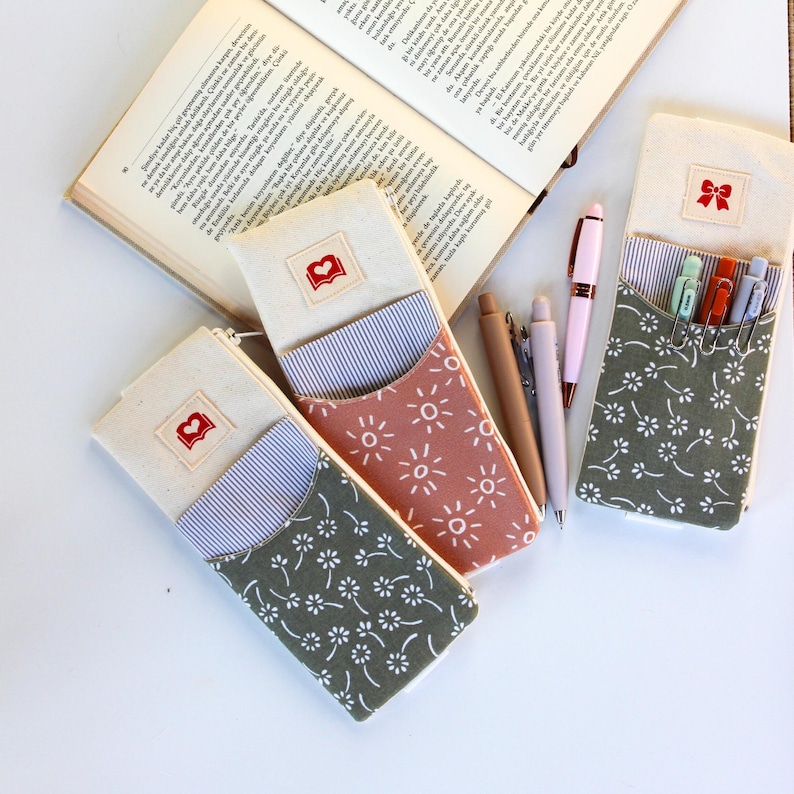 Elastic pencil pouch attached to planner notebook