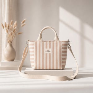 Small handmade tote bag with lining, zipper pocket, and long strap