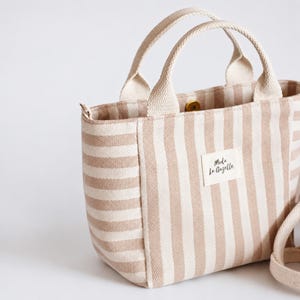 Handmade fabric tote bag with short handles and removable crossbody strap