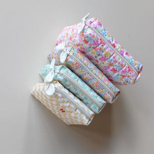 Quilted zipper pouch pattern with soft structure and clean finish