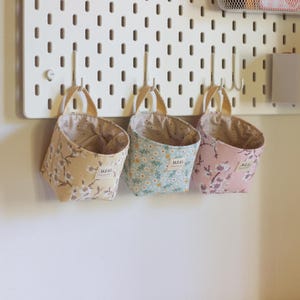 Desk storage basket sewing pattern mounted on IKEA Skadis pegboard